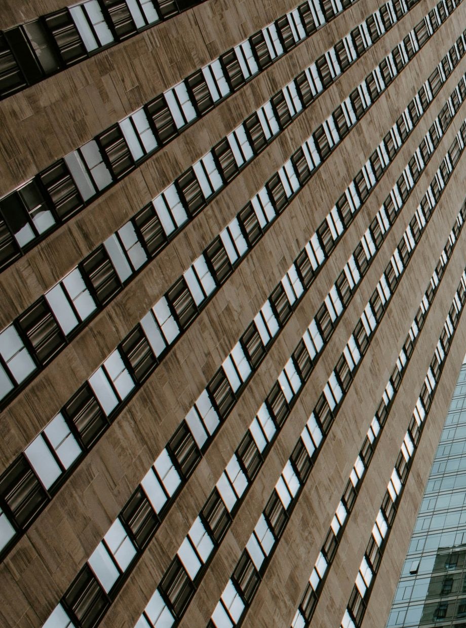 Stone institutional facade with a regular window grid